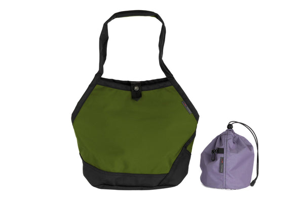 The Swift in Saguaro Ballistic with a Dawn (blue-grey with dark blue-grey grid) interior and Medium Yarn Stuff Sack